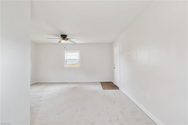 unfurnished room featuring ceiling fan and carpet floors