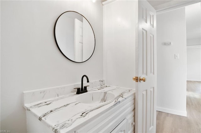 bathroom featuring vanity and wood-type flooring