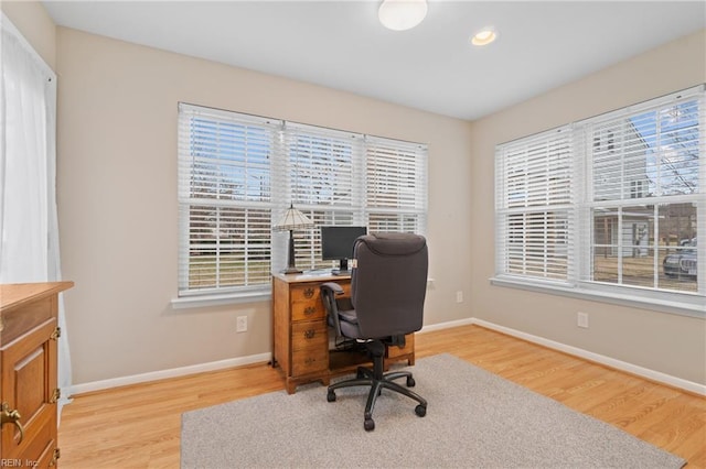 office space with light hardwood / wood-style flooring