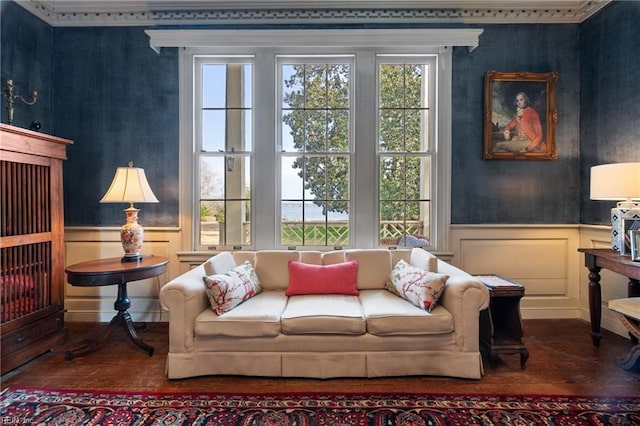 sitting room with hardwood / wood-style flooring and a healthy amount of sunlight