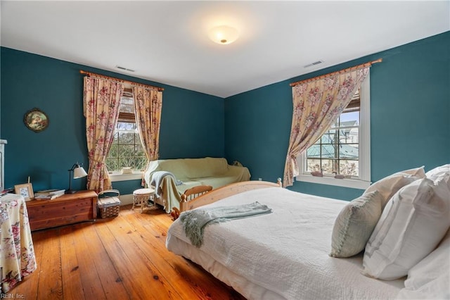 bedroom with hardwood / wood-style floors