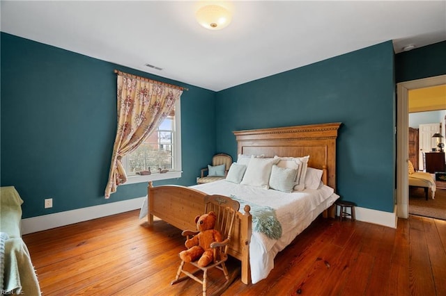 bedroom featuring hardwood / wood-style floors