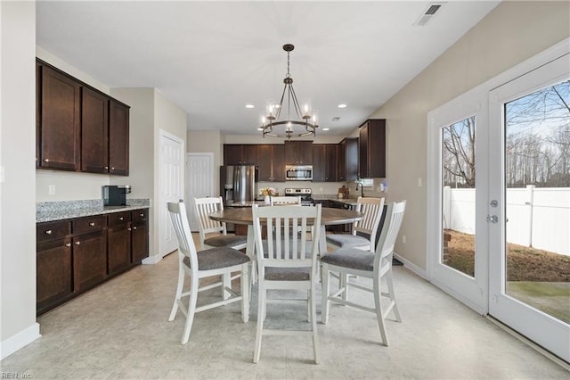 2608 River Watch Dr, Suffolk, VA 23434 - dining room with an inviting chandelier and french doors