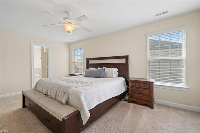 2608 River Watch Dr, Suffolk, VA 23434 - bedroom with light colored carpet, ceiling fan, and ensuite bath