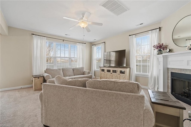 2608 River Watch Dr, Suffolk, VA 23434 - carpeted living room featuring ceiling fan, a healthy amount of sunlight, and a tiled fireplace