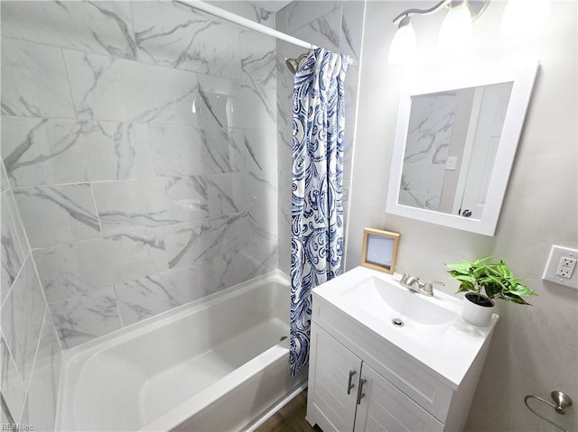 bathroom with shower / tub combo with curtain and vanity