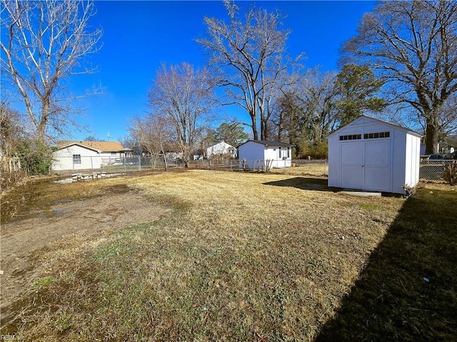 view of yard featuring a storage unit