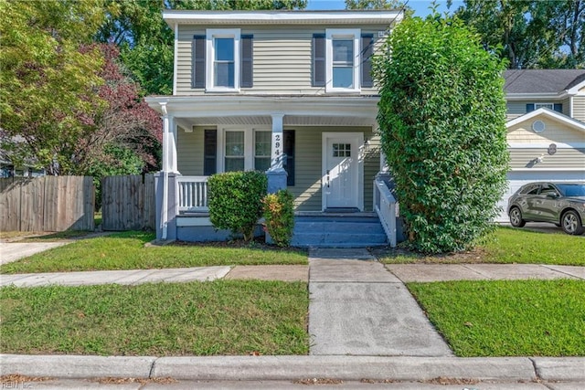 view of front of home featuring a front lawn and covered porch