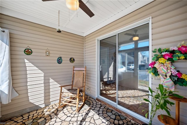 exterior space featuring ceiling fan