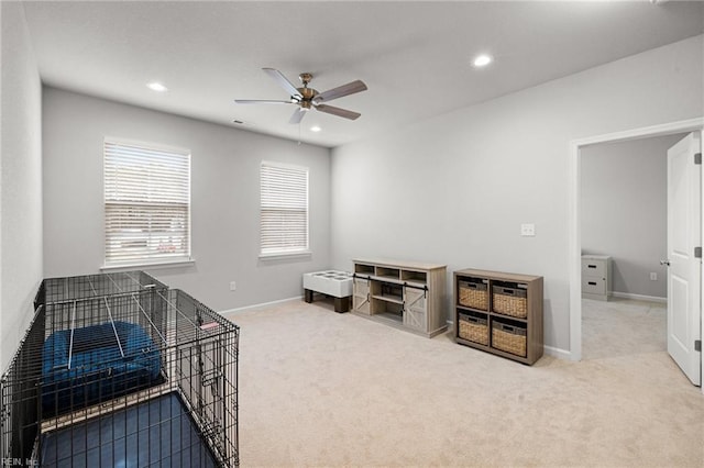 misc room with carpet and ceiling fan