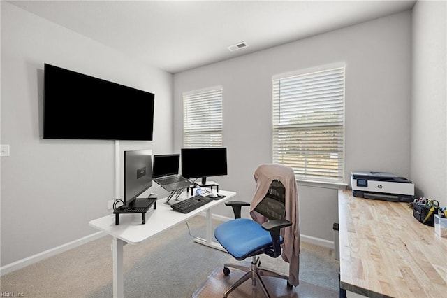 carpeted office space with plenty of natural light