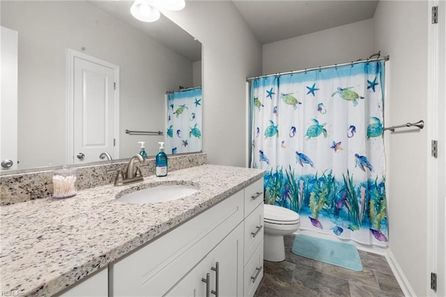 bathroom with vanity, toilet, and a shower with shower curtain