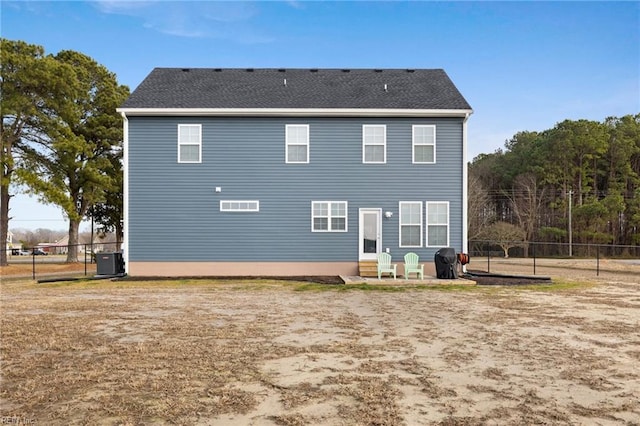 rear view of property featuring central AC unit