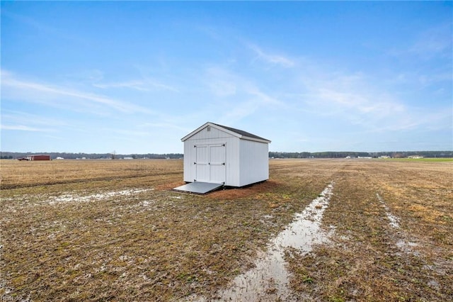 view of outbuilding featuring a rural view