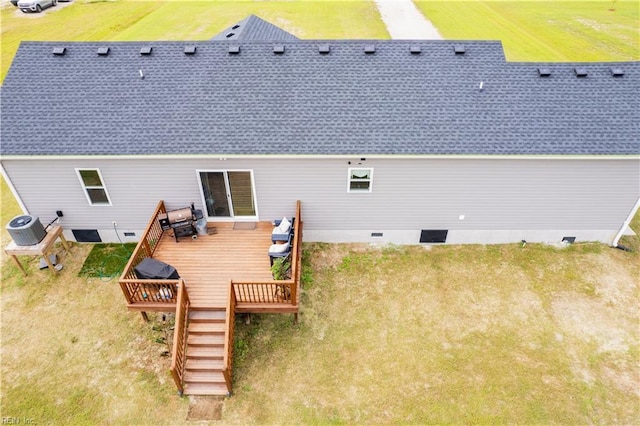 rear view of house featuring a wooden deck and central AC