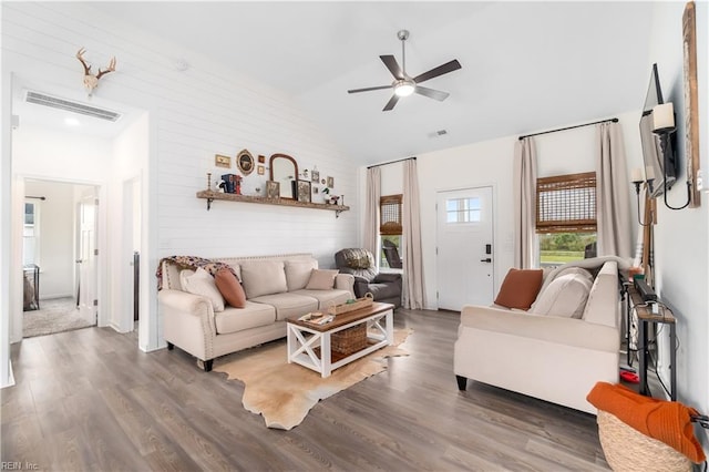 living room with high vaulted ceiling, dark hardwood / wood-style floors, and ceiling fan