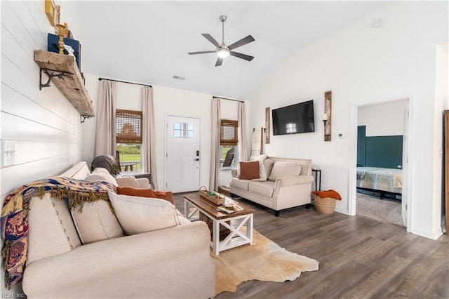 living room featuring lofted ceiling, wood-type flooring, and ceiling fan