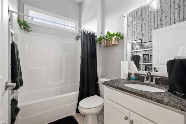 full bathroom featuring vanity, shower / bath combination with curtain, and toilet