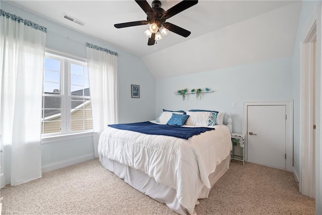 bedroom with lofted ceiling, light carpet, and ceiling fan