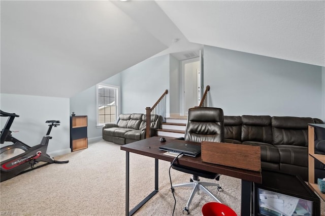 home office featuring vaulted ceiling and carpet flooring