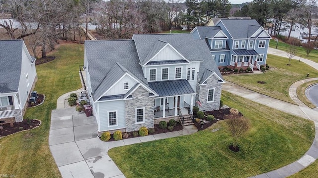 view of front of home featuring a front lawn and covered porch