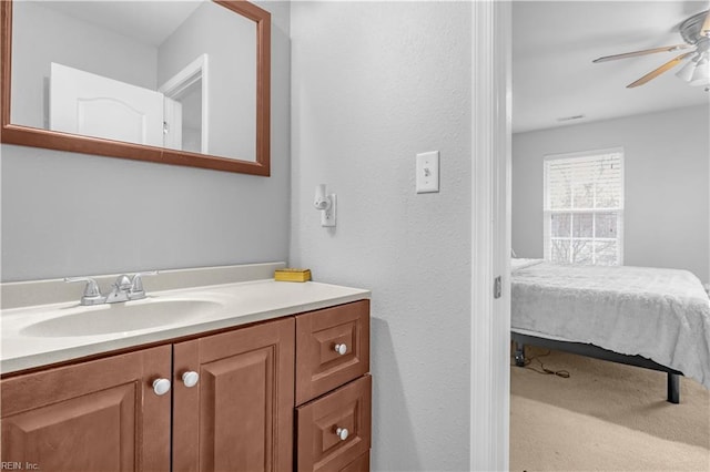 bathroom featuring vanity and ceiling fan