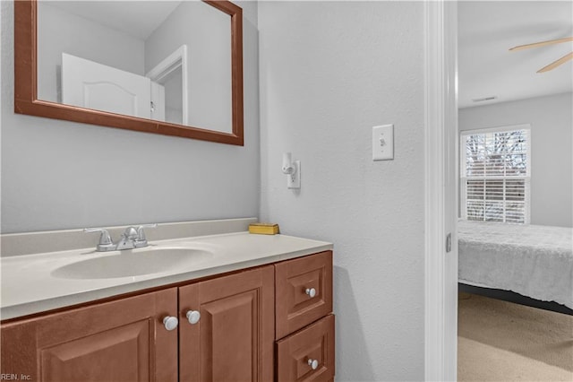 bathroom with vanity and ceiling fan