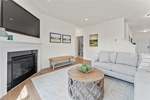 129 Getty Rd, Suffolk, VA 23434 - living room featuring wood finished floors, a glass covered fireplace, and baseboards