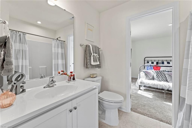 129 Getty Rd, Suffolk, VA 23434 - ensuite bathroom featuring tile patterned floors, toilet, vanity, and a shower with shower curtain