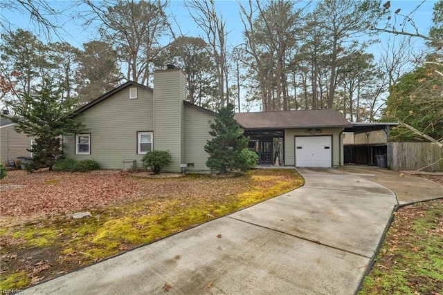 ranch-style home featuring a garage and a carport