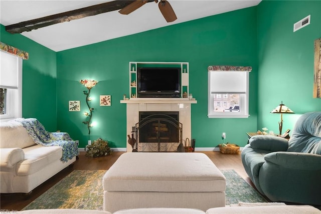 living room with dark wood-type flooring, vaulted ceiling with beams, and ceiling fan