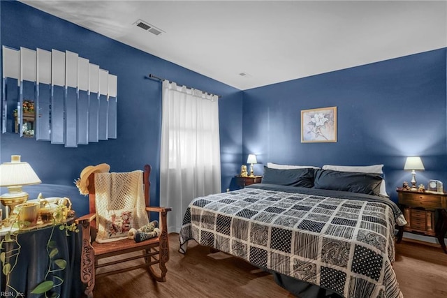 bedroom with wood-type flooring