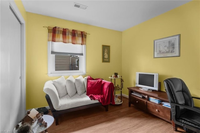 home office with hardwood / wood-style flooring