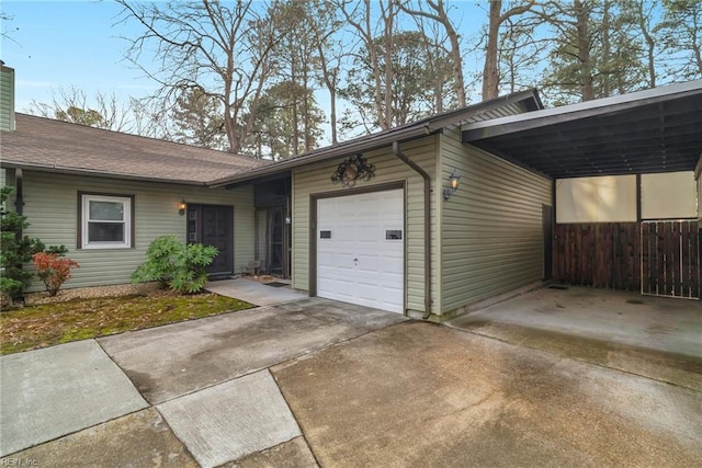 exterior space with a garage and a carport