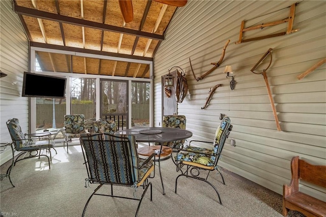 sunroom featuring lofted ceiling with beams and wood ceiling