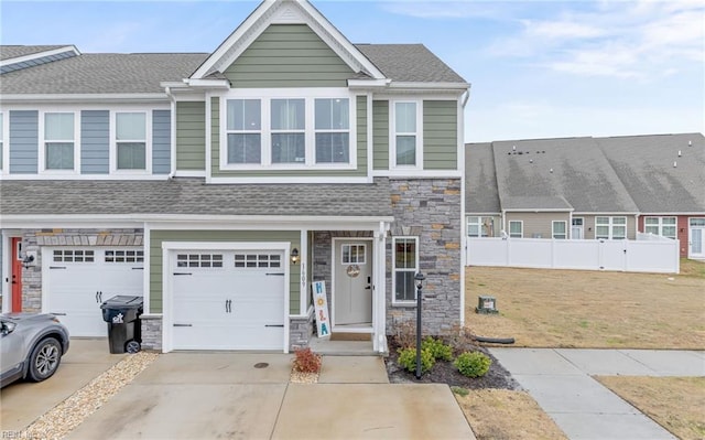 view of front of property featuring a garage and a front yard