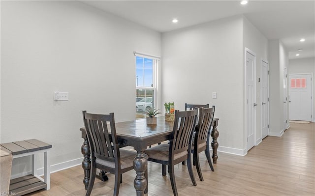 dining space featuring light wood-type flooring