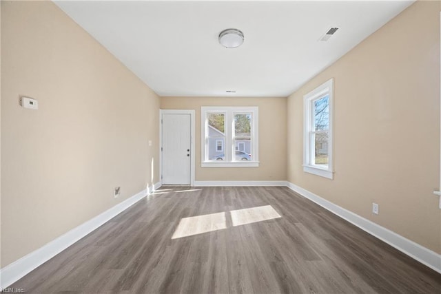 spare room with wood-type flooring