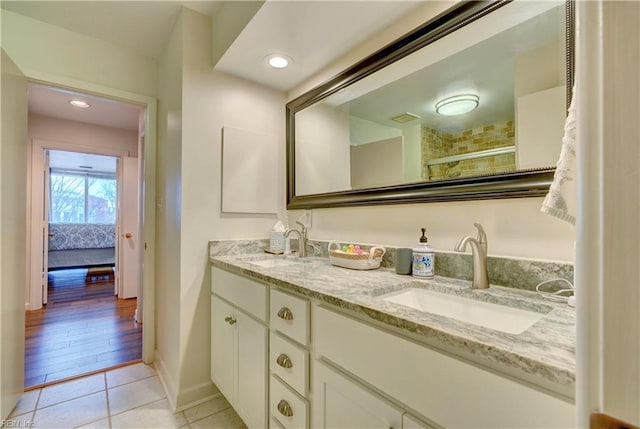 bathroom featuring tile patterned flooring and vanity