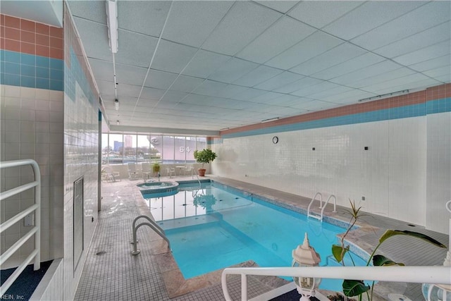 view of swimming pool with an indoor in ground hot tub