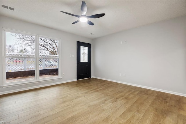 foyer entrance featuring ceiling fan and light hardwood / wood-style floors