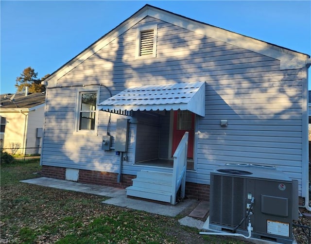 back of property featuring central air condition unit