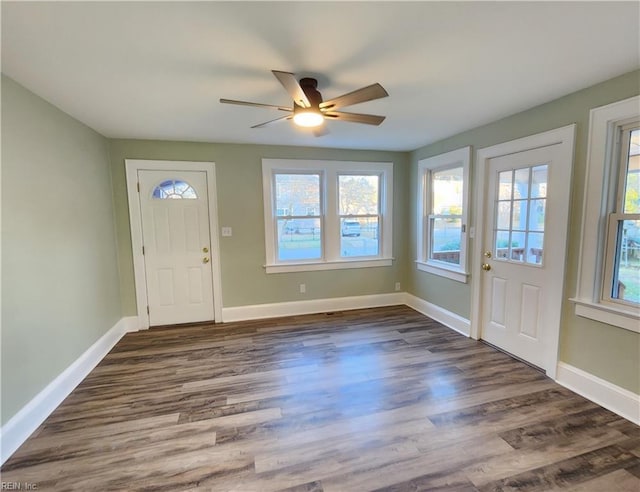 entryway with ceiling fan and dark hardwood / wood-style flooring