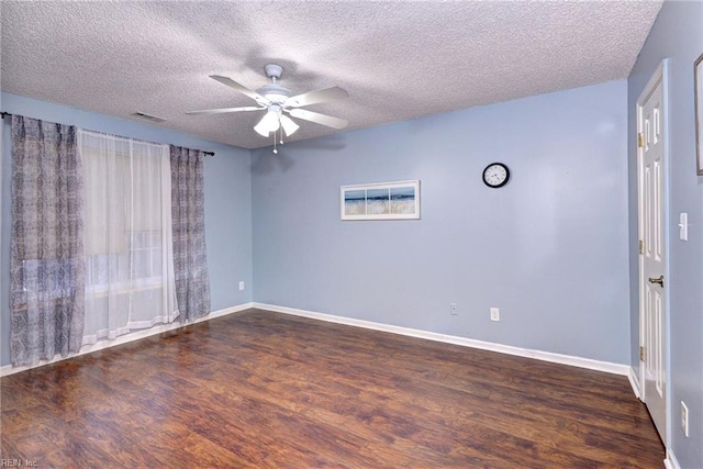 empty room with ceiling fan, a textured ceiling, and dark hardwood / wood-style flooring