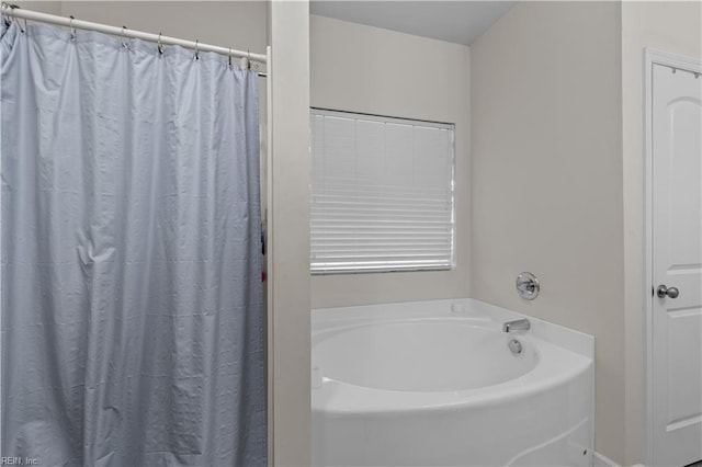 bathroom featuring a washtub