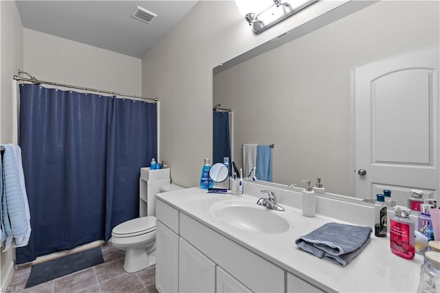 bathroom featuring vanity, toilet, and a shower with shower curtain