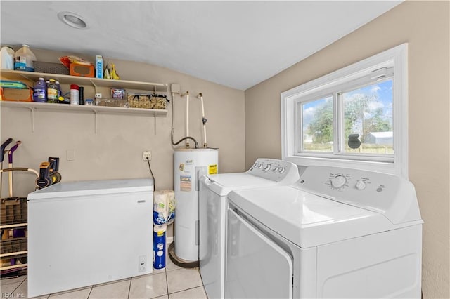 laundry area featuring separate washer and dryer, electric water heater, and light tile patterned floors