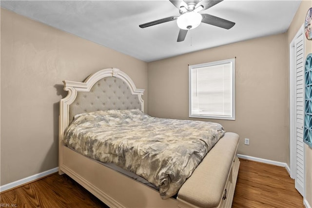 bedroom with hardwood / wood-style floors and ceiling fan