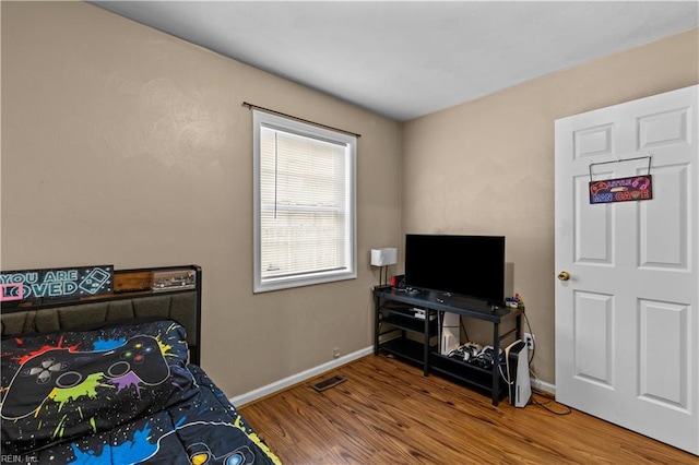 bedroom featuring wood-type flooring