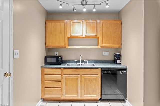 kitchen with sink, light brown cabinets, and black appliances